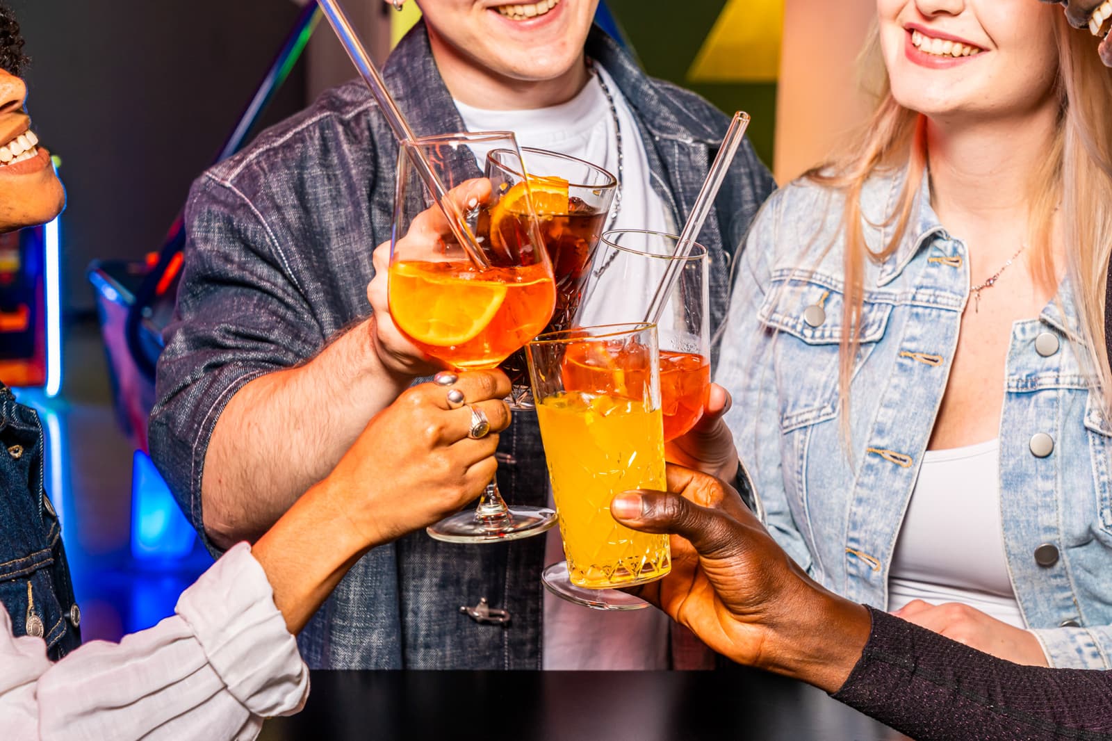 A group of friends toasting with drinks together