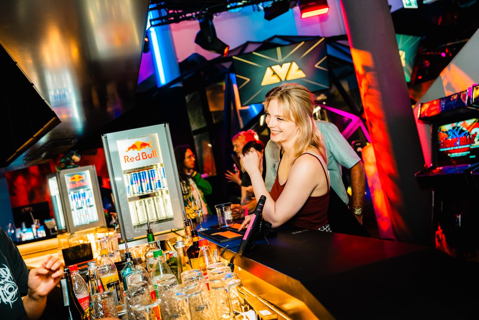 A bartender smiling behind the LVL bar