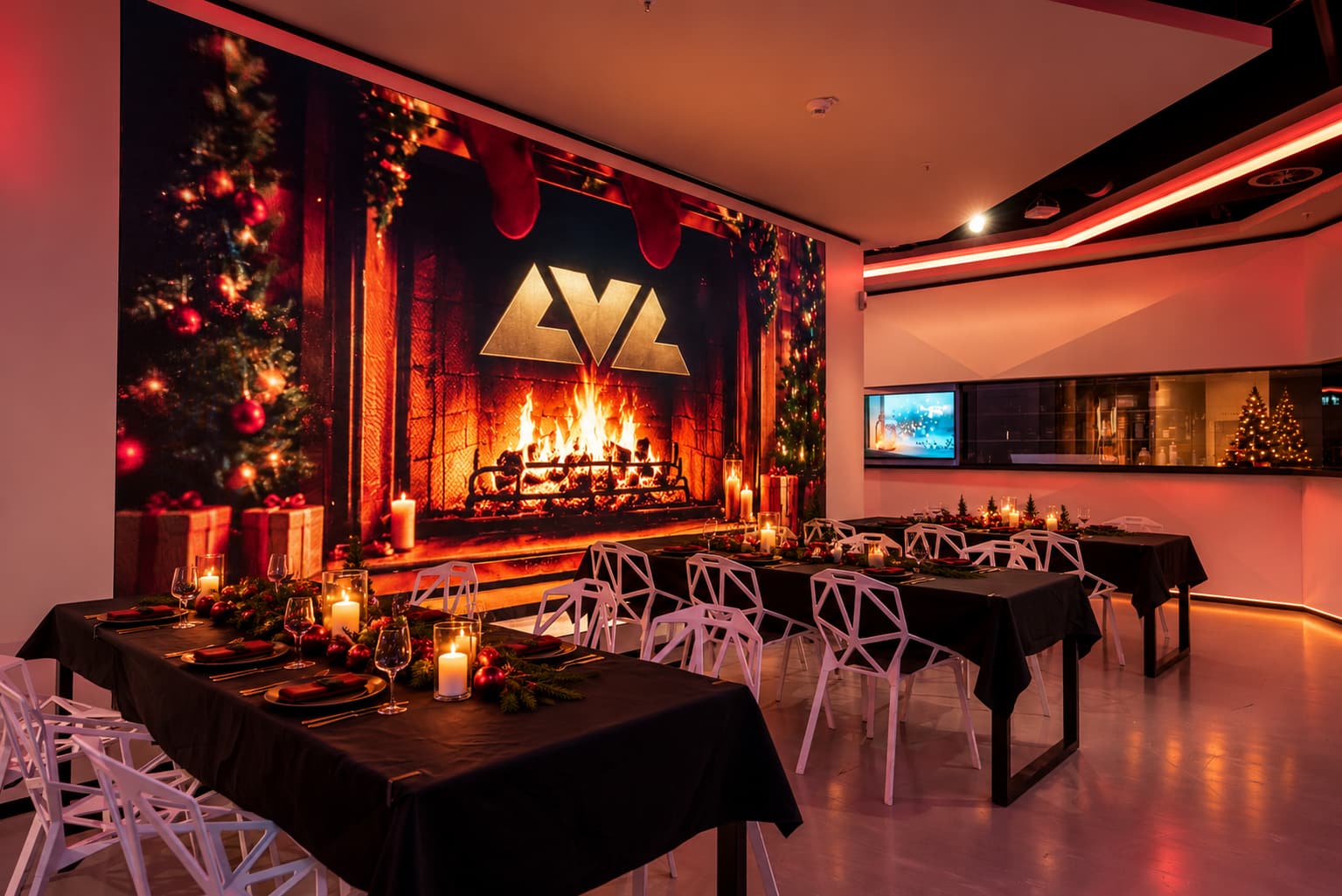 A festive fireplace screen glowing behind reserved dinner tables in the venue