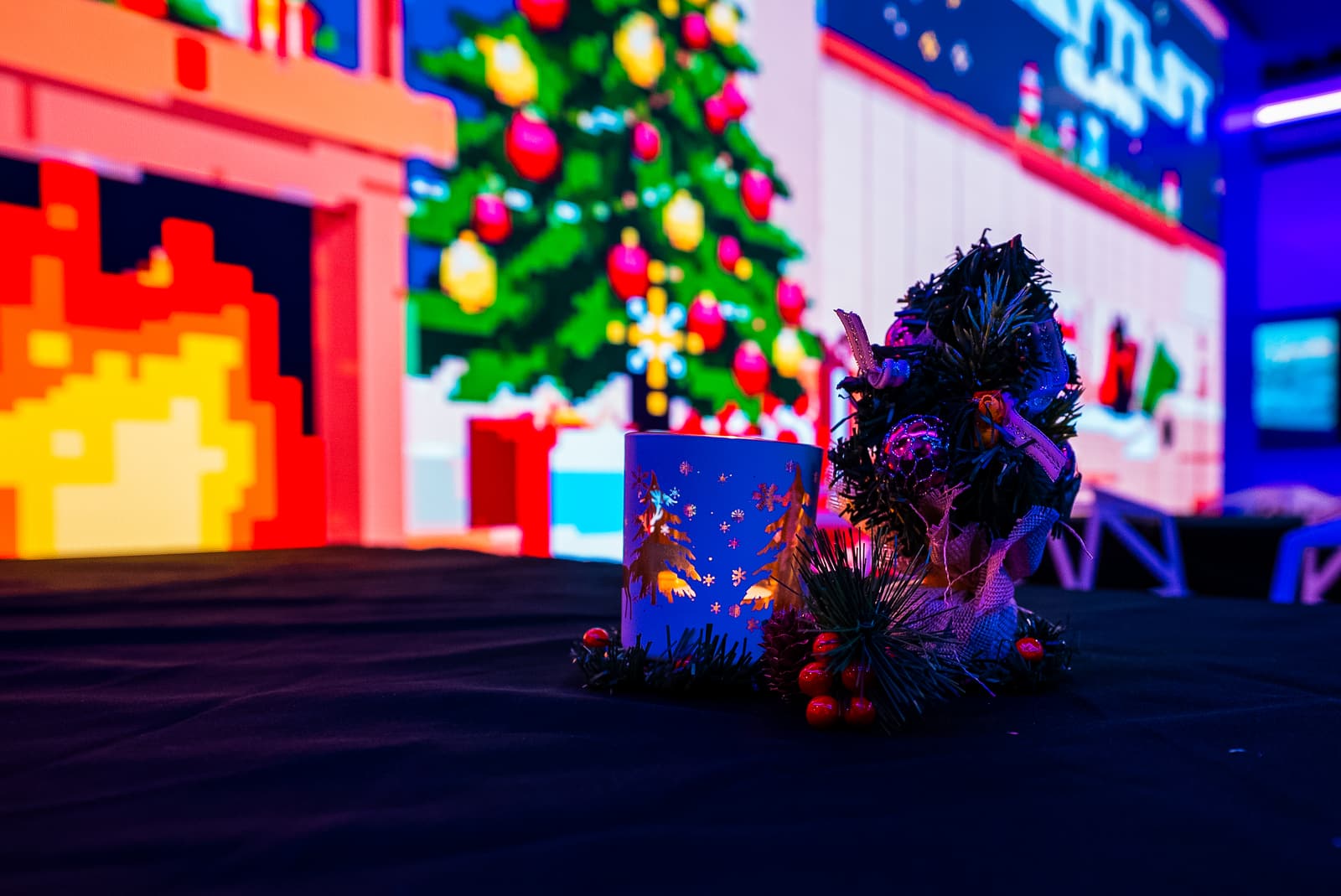 A festive candle centerpiece on a reserved table