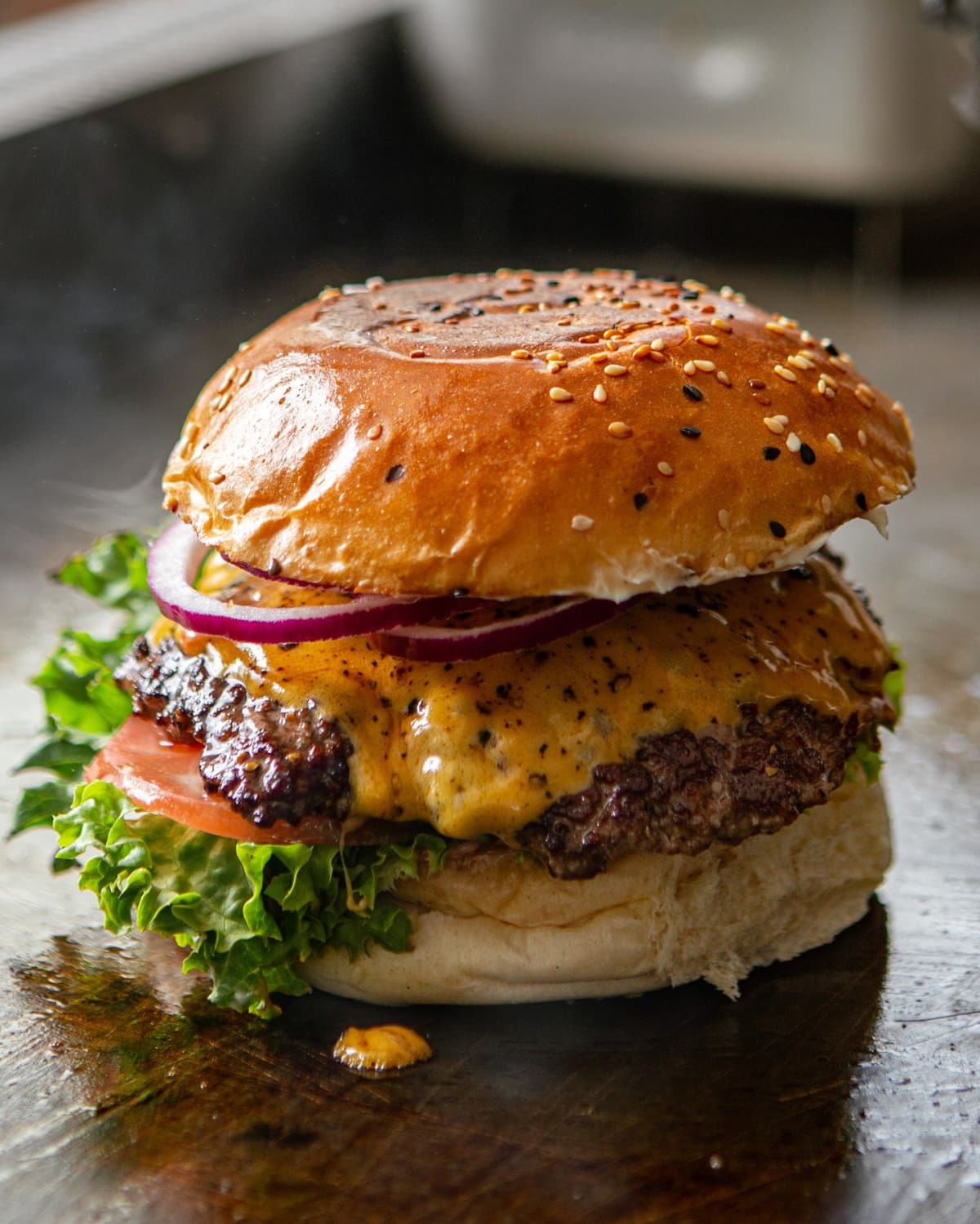 Close-up of a burger being served