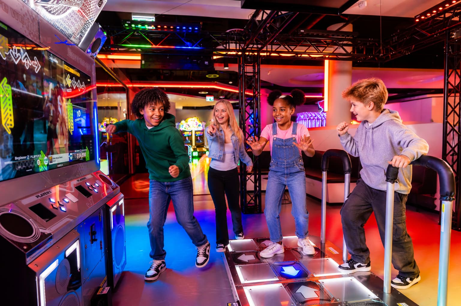 Kids dancing together on the DDR World cabinet at a birthday party