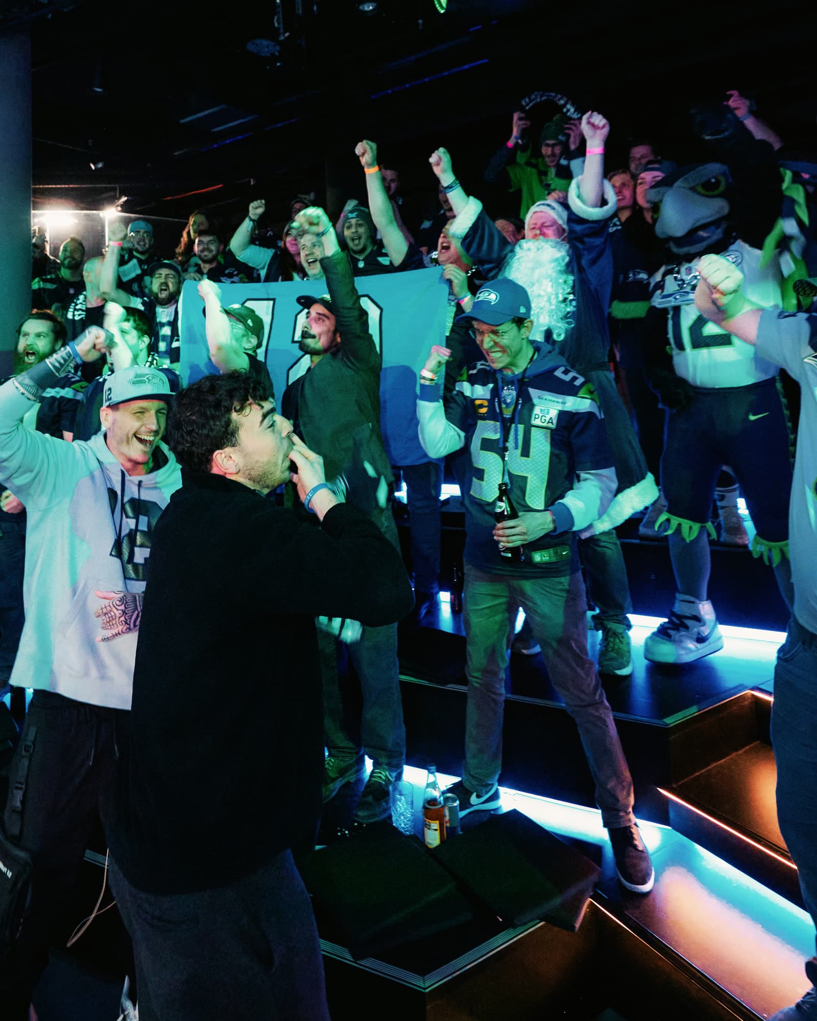 Fans celebrating at an NFL watch party at LVL