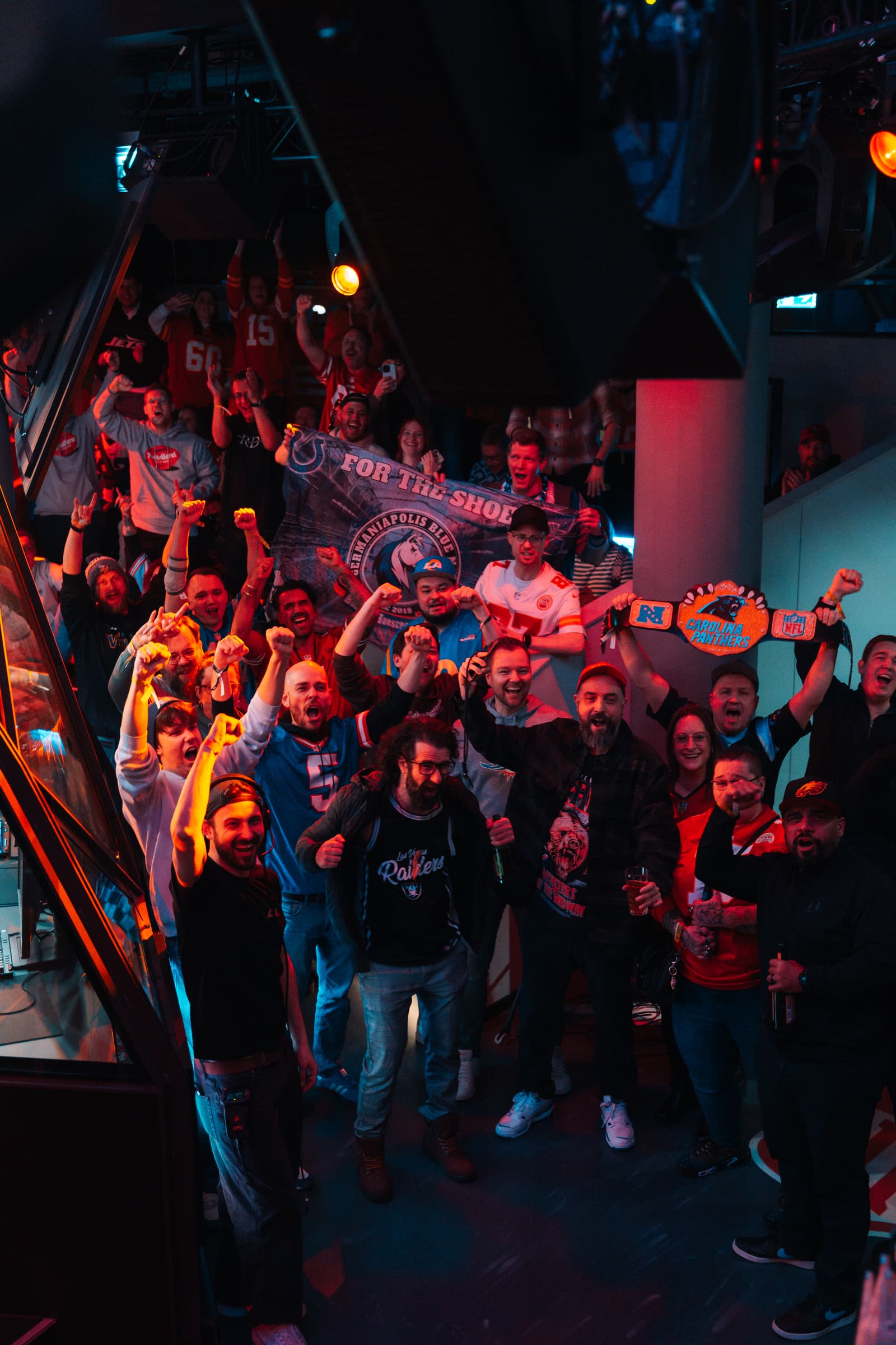 Crowd cheering at an NFL watch party at LVL